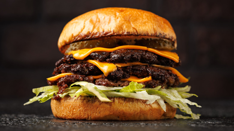 a triple smash burger with cheese