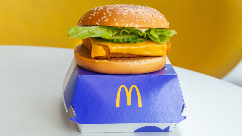 A Filet-O-Fish on top of a McDonald's box.