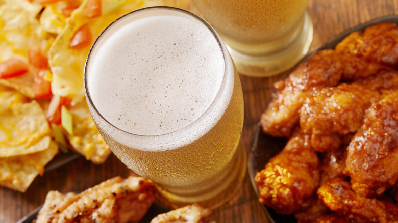 Pint of beer and wings, nachos