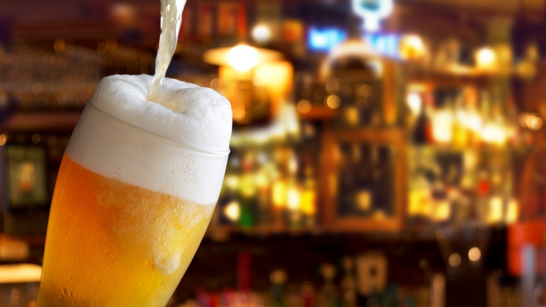 Beer with foam head and stream
