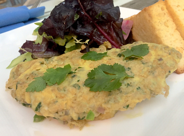 A few fresh ingredients and spices make up this simple Indian omelet. Serve with toast for a hearty brunch.
