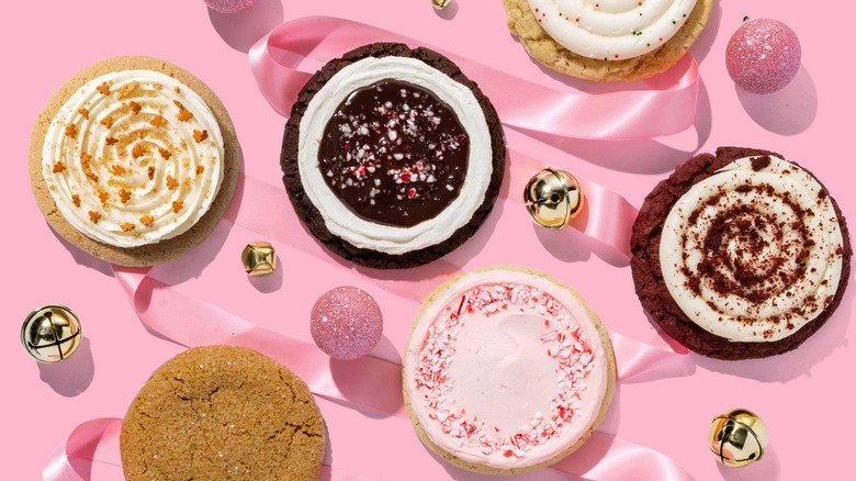 Assorted Crumbl cookies with pink ribbon