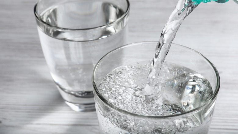 Pouring water in glass