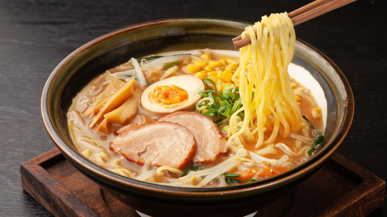 Bowl of ramen with a boiled egg and pork belly