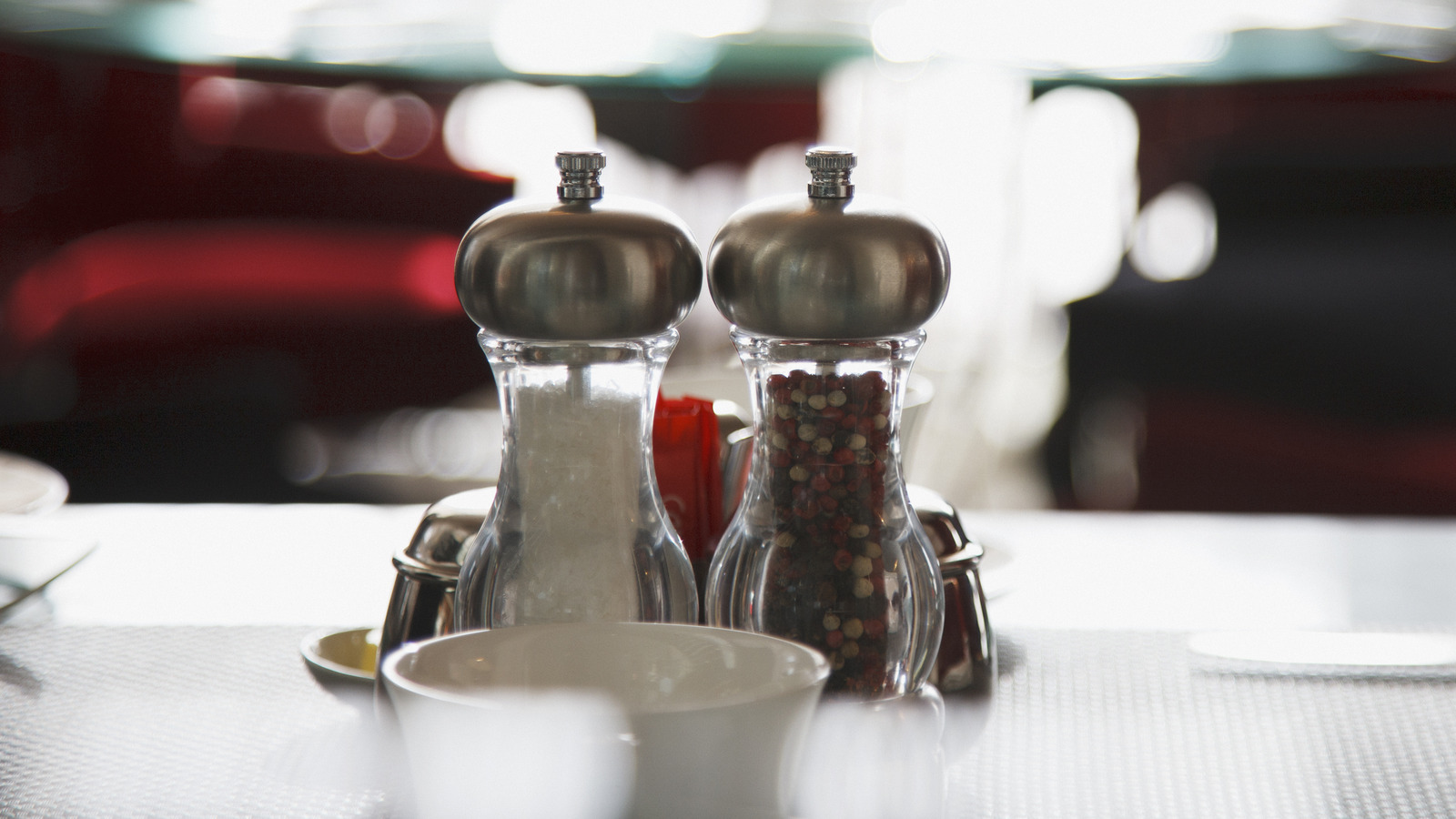 The Reason Some Fancy Restaurants Don't Have Salt And Pepper Shakers