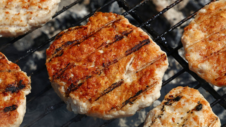 Turkey burgers cooking on the grill