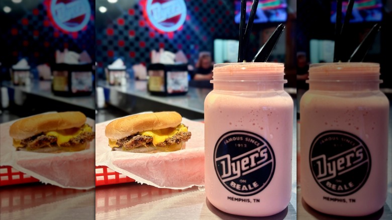 A cheeseburger sits next to a milkshake at Dyer's Burgers.