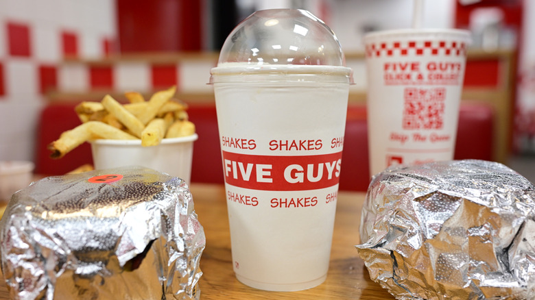A Five Guys meal featuring burgers and fries.