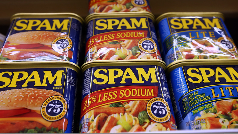Cans of Spam sit stacked on top of each other