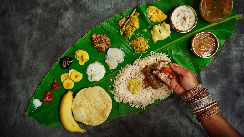 Eating Indian thali off banana leaf by hand
