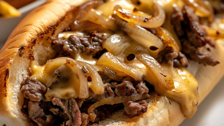 Closeup of a cheesesteak.
