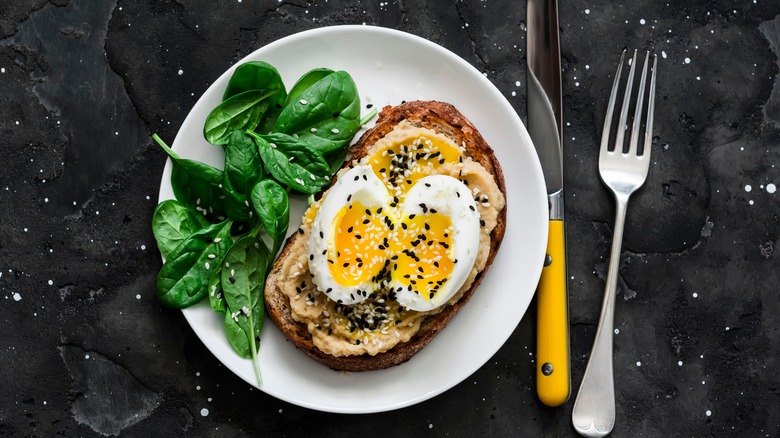 boiled egg on toast with hummus