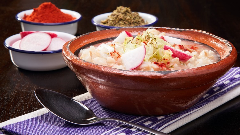 Pozole served in clay bowl
