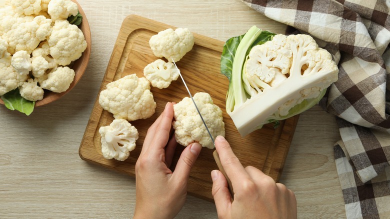Cauliflower florets being cut