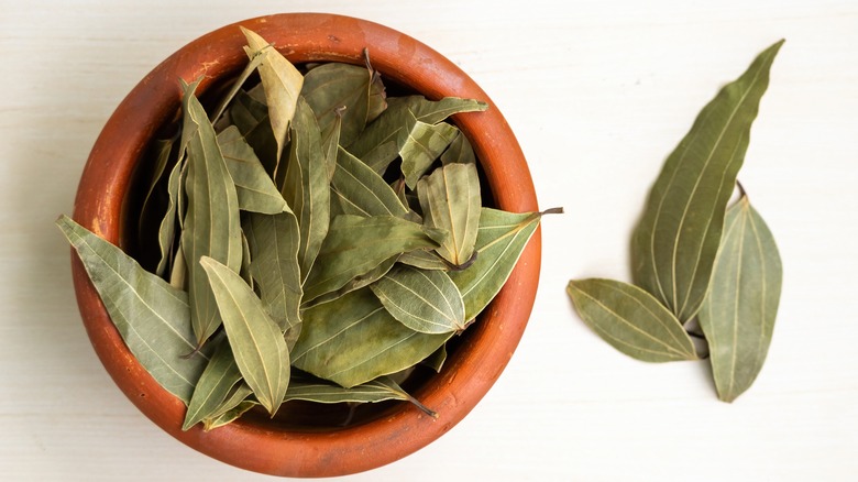 Dried bay leaves in a bowl