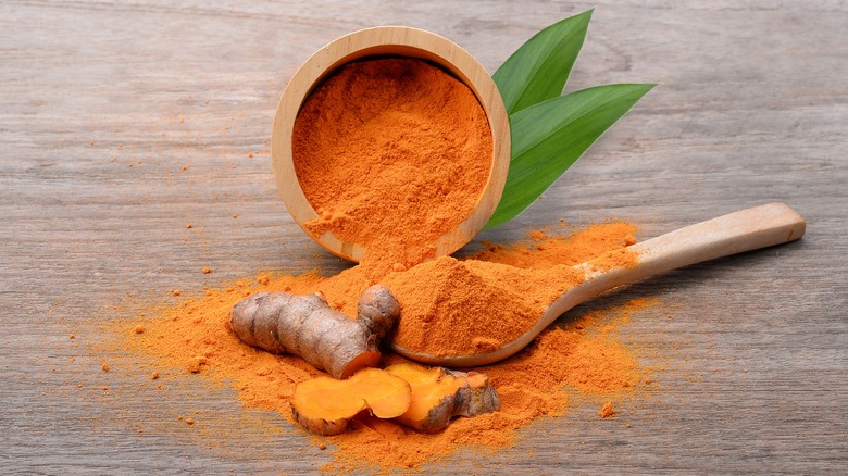 A small cup of turmeric and garlic root
