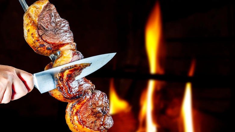 meat sliced at Brazilian steakhouse