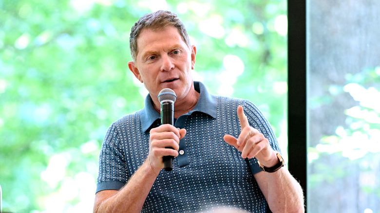 Bobby Flay speaking at an event.