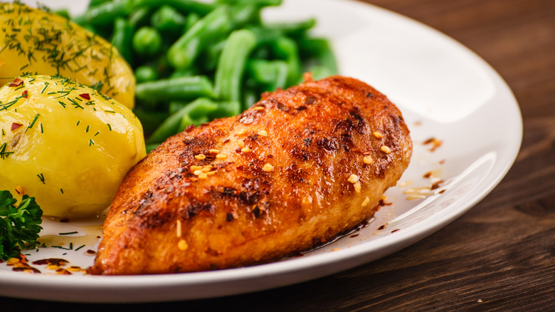 roast chicken breast served with vegatables