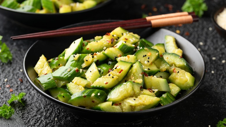 bowl of cucumber salad with sesame and pepper