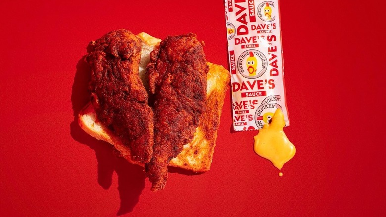 Dave's Hot Chicken and toast with packet of sauce