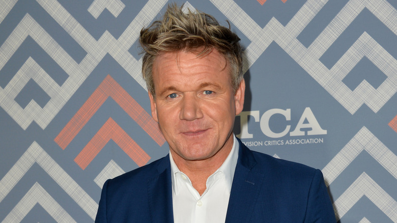 Closeup of Gordon Ramsey in a white shirt and blue suit jacket
