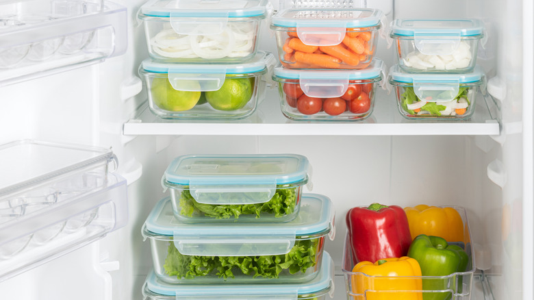 Efficiently fridge shelves stocked with food in easy to grab containers