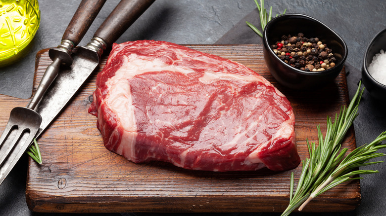 raw steak on a cutting board
