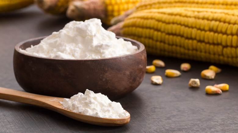 cornstarch in wooden bowl with corn in background