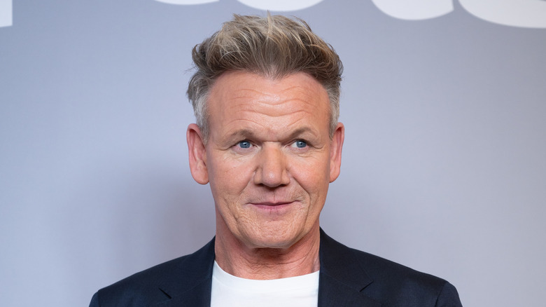 Gordon Ramsay posing at an event.