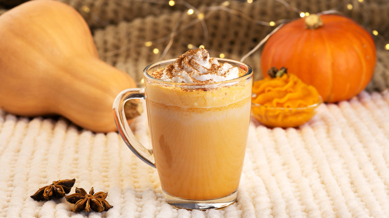Pumpkin spice latte served in a glass.