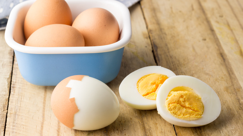 Hard boiled eggs that need to be peeled with halved egg