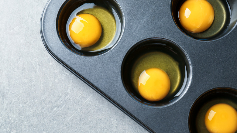 raw eggs in muffin tin