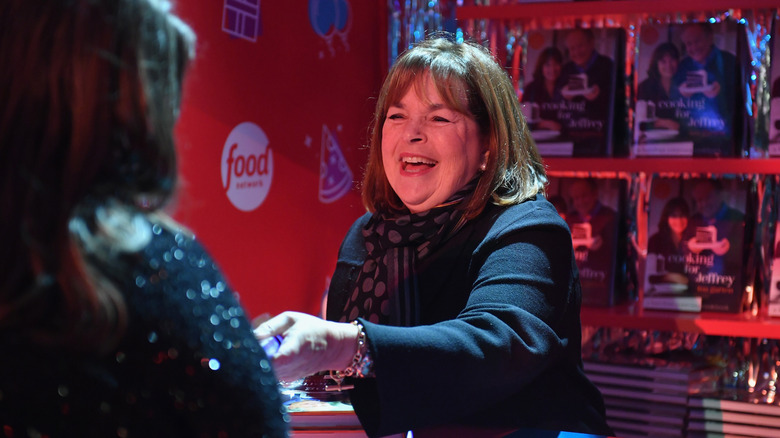 Ina Garten laughing at a book signing