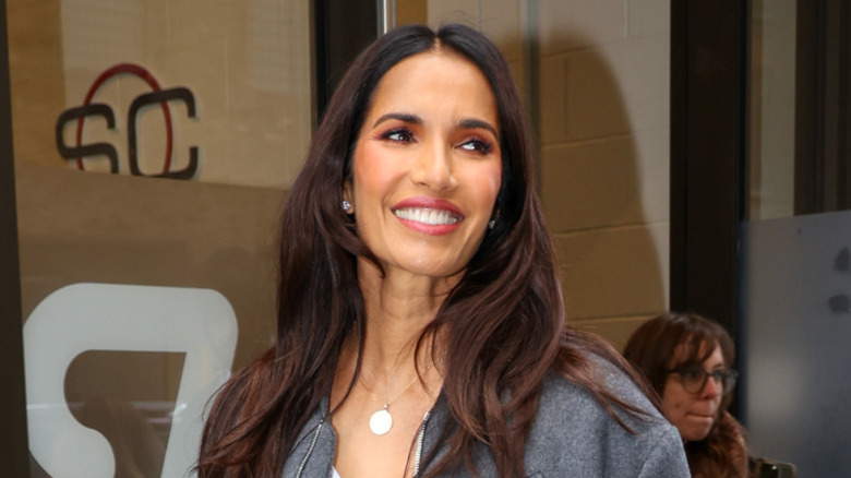 Padma Lakshmi smiling as she walks in NYC