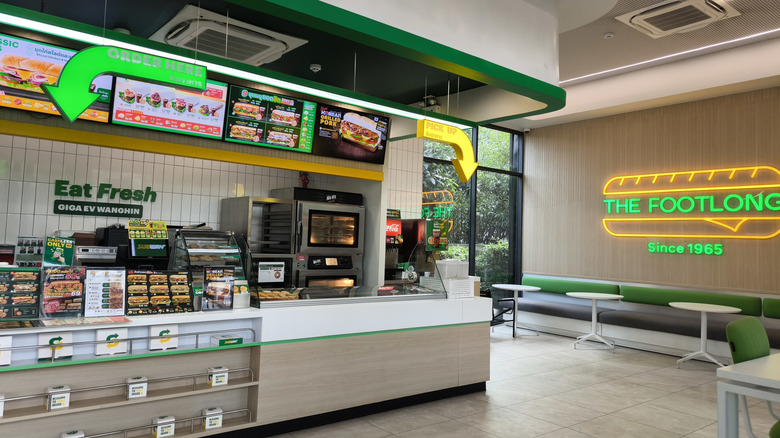 The interior of a Subway restaurant in Bangkok, Thailand.