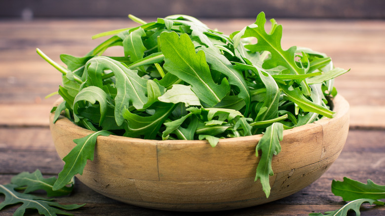 Arugula in a wooden bowl