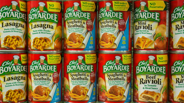Various Chef Boyardee products on shelves.