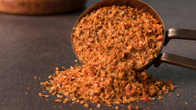 Tajín seasoning spilling from spoon