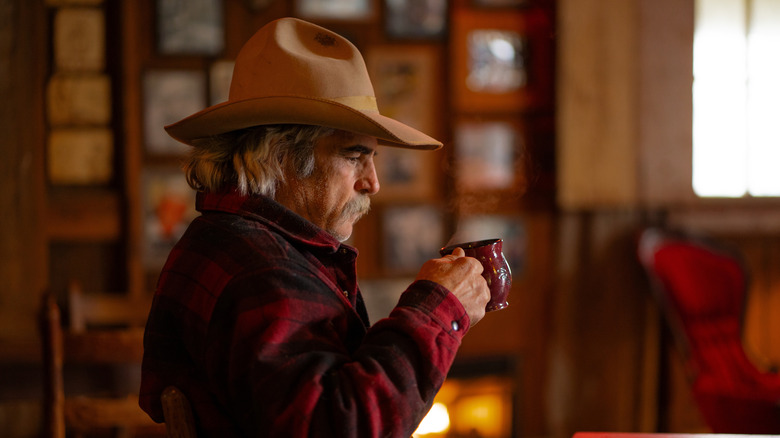 A cowboy drinking coffee.
