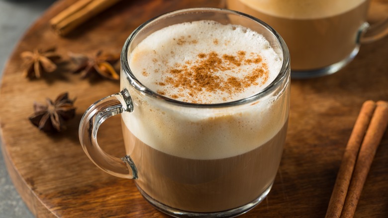 chai latte in glass mug with spices