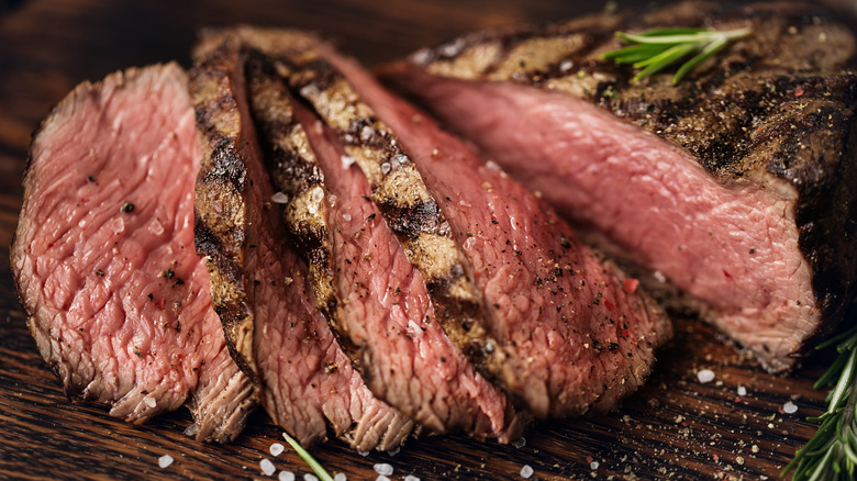 Closeup of medium rare cooked, sliced steak
