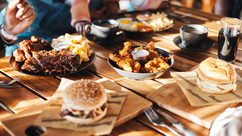 Customers enjoying a variety of casual dining dishes at restaurant