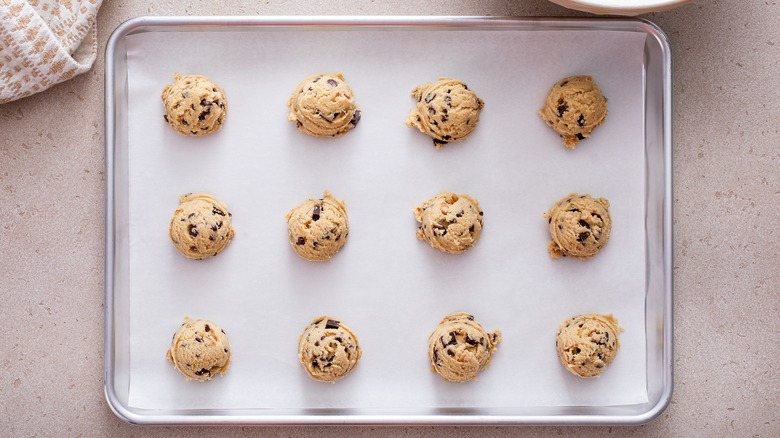 raw cookie dough on a baking sheet
