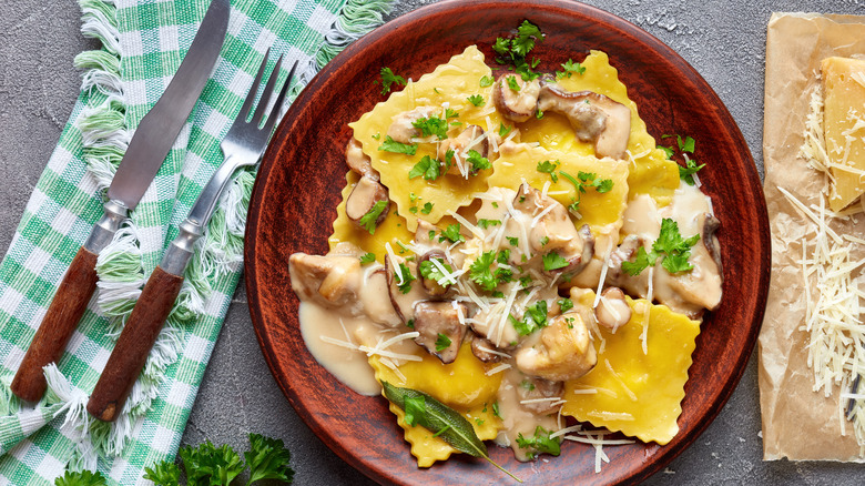 square ravioli on a brown plate