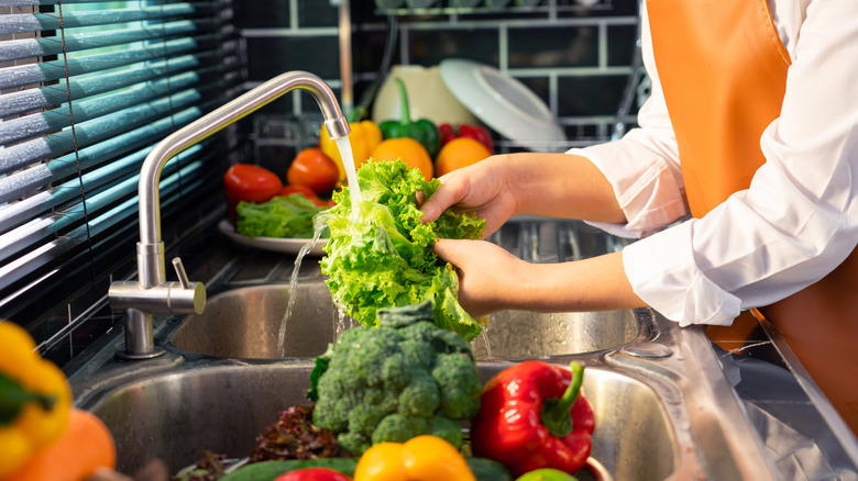 Woman washing produce