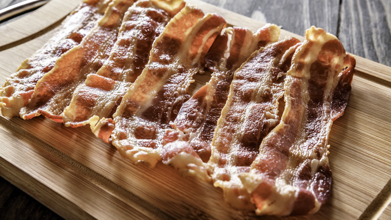 Cooked bacon on a cutting board