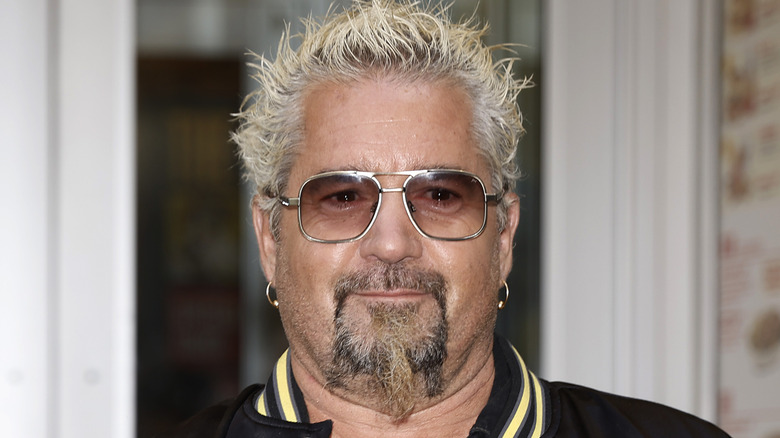 Guy Fieri smiling as he opens Chicken Guy in New York City