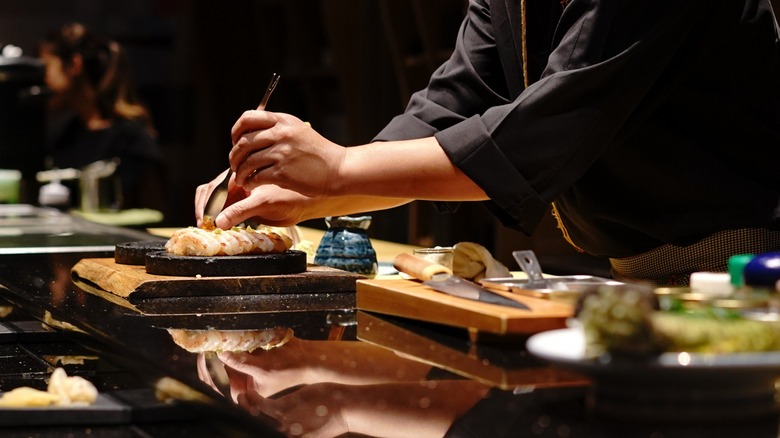Itamae chef preparing sushi