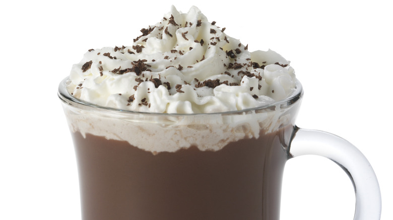 whipped cream and chocolate on chocolate dessert